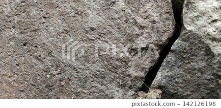 Rough and Cracked Dark Stone Wall Texture Rough and Cracked Dark Stone Wall Texture 142126198