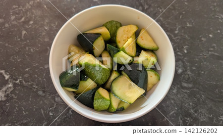 Fresh cucumber and zucchini salad with sesame oil Fresh cucumber and zucchini salad with sesame oil 142126202