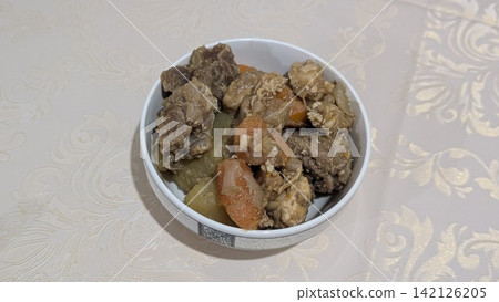 Hearty homemade meat and vegetable stew in a bowl Hearty homemade meat and vegetable stew in a bowl 142126205