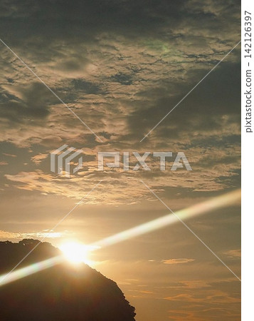 The sun coming out of the clouds 142126397