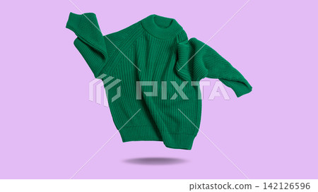 Green knitted sweater levitating on purple background. Floating crewneck pullover banner studio shot 142126596