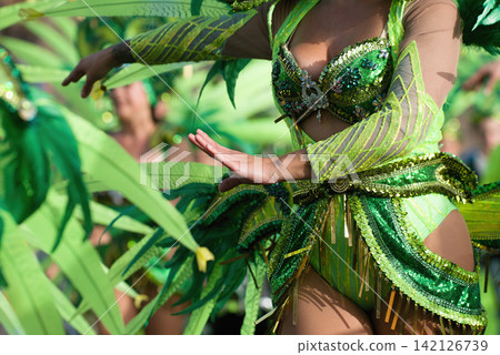 A woman in costume dancing on carnival, dancers during the carnival A woman in costume dancing on carnival, dancers during the carnival 142126739