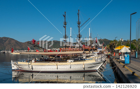 Wooden tourist boats moored at Marmaris embankment in Turkey Wooden tourist boats moored at Marmaris embankment in Turkey 142126920