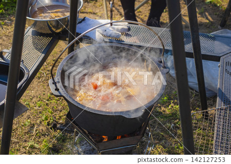 Cooking hot pot outdoors Cooking hot pot outdoors 142127253