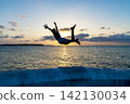 Boy jumping into the sea 142130034