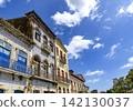 Houses facades covered in 18th-century tiles 142130037