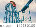 Amusement park roller coaster (blurred image) 142130185