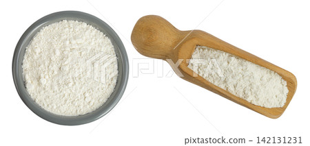 White flour in ceramic bowl and wooden scoop isolated on white background. Top view. Flat lay. White flour in ceramic bowl and wooden scoop isolated on white background. Top view. Flat lay. 142131231
