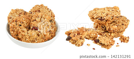 Granola cookie in ceramic bowl isolated on white background with full depth of field Granola cookie in ceramic bowl isolated on white background with full depth of field 142131291