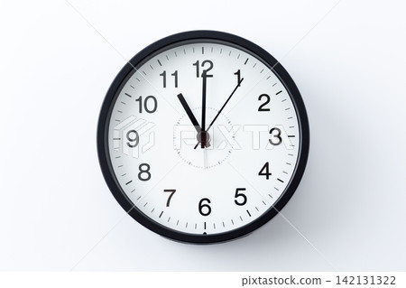 A clock showing 11 o'clock A clock showing 11 o'clock 142131322