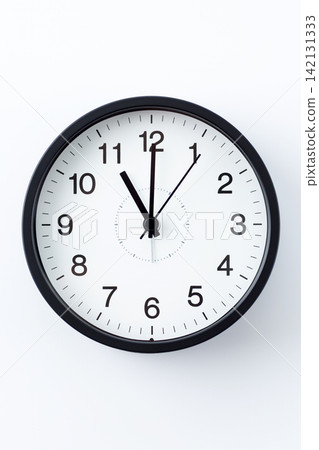 A clock showing 11 o'clock A clock showing 11 o'clock 142131333