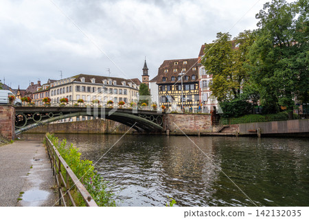 Iron bridge and colorful houses on the Ill river Strasbourg, France Iron bridge and colorful houses on the Ill river Strasbourg, France 142132035