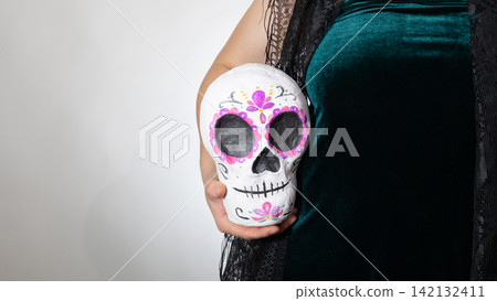 Day of the Dead Calavera Sugar Skull Held for Display with Copy Space Day of the Dead Calavera Sugar Skull Held for Display with Copy Space 142132411