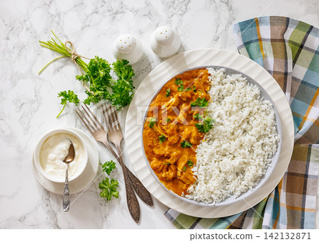 Creamy paprika chicken breast strips with rice Creamy paprika chicken breast strips with rice 142132871
