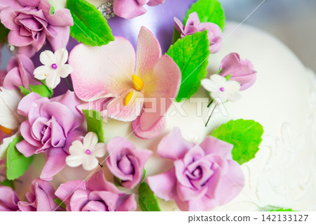 wedding cake decoration. beautiful wedding cake with purple orchids. cake in violet tones wedding cake decoration. beautiful wedding cake with purple orchids. cake in violet tones 142133127