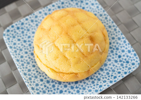 The fluffy, sweet moment of freshly baked melon bread. The fluffy, sweet moment of freshly baked melon bread. 142133266