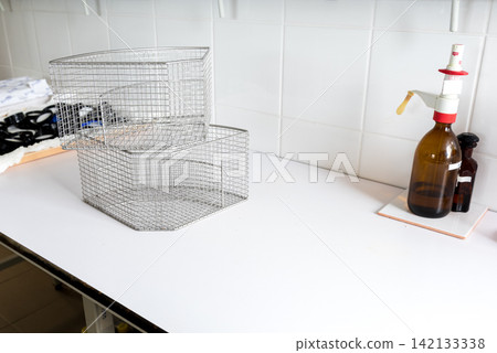 metal wire baskets and mesh trays in laboratory workspace metal wire baskets and mesh trays in laboratory workspace 142133338