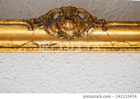 Vintage Gold Frame With Intricate Detailing From a Decorative Art Piece in a Classic Style Setting Vintage Gold Frame With Intricate Detailing From a Decorative Art Piece in a Classic Style Setting 142133434