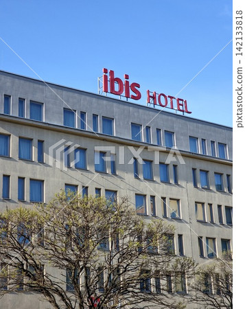 Krakow, Poland - April 22, 2026: Ibis Hotel Sign on Multi-Story Building Facade 142133818