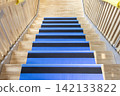 Staircase of the newly constructed wooden school building, which has been protected during construction. 142133822