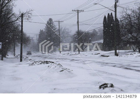 Snowstorm on Residential Street. 142134879