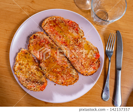 Toasted bread with garlic and tomatoes top view Toasted bread with garlic and tomatoes top view 142137357