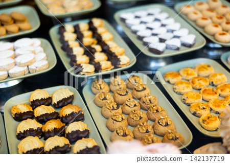 cookies with toppings on display in the store cookies with toppings on display in the store 142137719