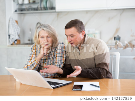 Old woman considering offer from agent 142137839