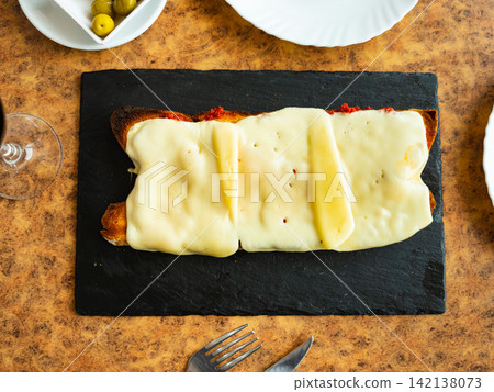 Several baked cheese sandwiches are served on board, at breakfast or lunch time Several baked cheese sandwiches are served on board, at breakfast or lunch time 142138073