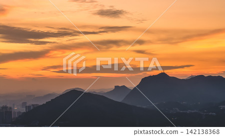 Hong Kong Aug 5 2026 Lion Rock mountain silhouette against vibrant sunset sky Hong Kong Aug 5 2026 Lion Rock mountain silhouette against vibrant sunset sky 142138368