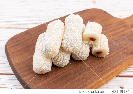 coconut Shred Mochi Rolls Filled with Fruit Jam coconut Shred Mochi Rolls Filled with Fruit Jam 142139185