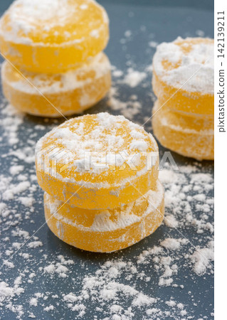 sour Lemon Hard Candies Coated with Powdered Sugar sour Lemon Hard Candies Coated with Powdered Sugar 142139211