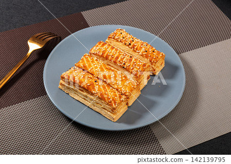 savory Layered Puff Pastry Snack with Crispy Texture savory Layered Puff Pastry Snack with Crispy Texture 142139795
