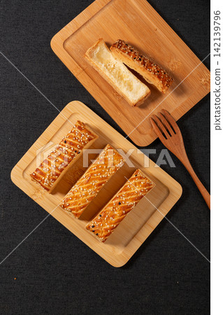 savory Layered Puff Pastry Snack with Crispy Texture savory Layered Puff Pastry Snack with Crispy Texture 142139796
