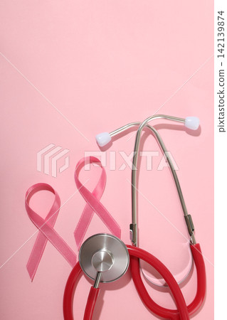 Stethoscope and two pink ribbons on soft pink background Stethoscope and two pink ribbons on soft pink background 142139874