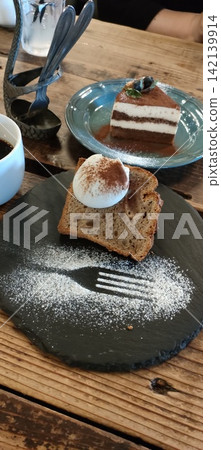 Chiffon cake and coffee at a stylish cafe. 142139914