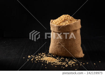 raw Whole Grain Brown Rice in Burlap Sack raw Whole Grain Brown Rice in Burlap Sack 142139973