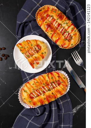 baked Sausage Bread Roll With Cheese Topping baked Sausage Bread Roll With Cheese Topping 142141123