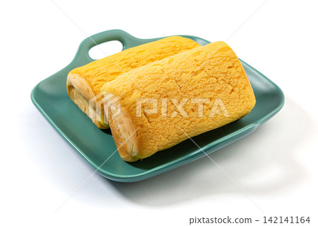 soft Custard Cream Swiss Rolls Served On Green Ceramic Plate 142141164