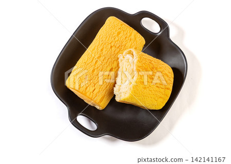 soft Custard Cream Swiss Rolls Served On Green Ceramic Plate soft Custard Cream Swiss Rolls Served On Green Ceramic Plate 142141167