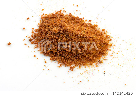 brown Sugar Powder on Red Spoon Isolated brown Sugar Powder on Red Spoon Isolated 142141420
