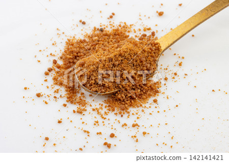 brown Sugar Powder on Red Spoon Isolated brown Sugar Powder on Red Spoon Isolated 142141421