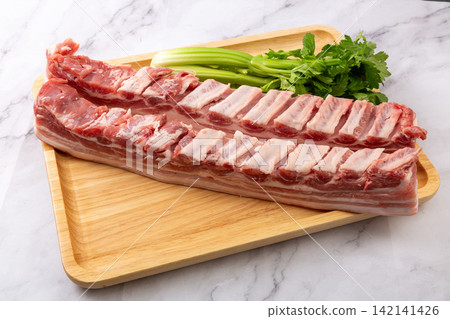 raw Pork Belly with Rib Bones and Celery raw Pork Belly with Rib Bones and Celery 142141426