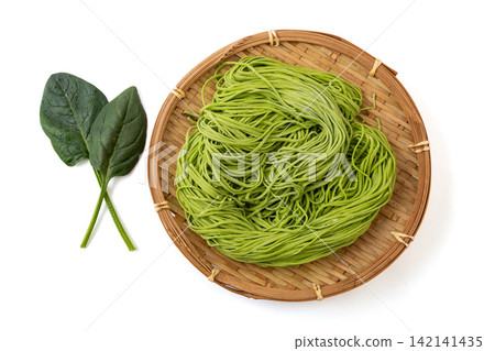 fresh Green Spinach Noodles on Wooden Cutting Board fresh Green Spinach Noodles on Wooden Cutting Board 142141435