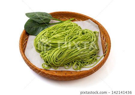 fresh Green Spinach Noodles on Wooden Cutting Board 142141436