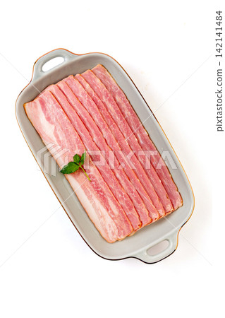 raw Pork Bacon Strips in Ceramic Dish raw Pork Bacon Strips in Ceramic Dish 142141484