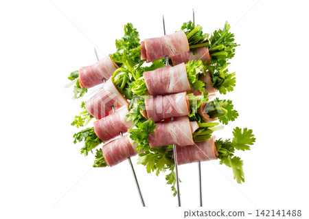 raw Bacon Wrapped Cilantro Skewers on Metal Skewers raw Bacon Wrapped Cilantro Skewers on Metal Skewers 142141488