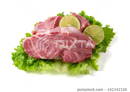 raw Pork Collar Steaks with Lime Slices raw Pork Collar Steaks with Lime Slices 142141526