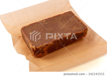 sugarcane Brown Sugar Block on Parchment Paper sugarcane Brown Sugar Block on Parchment Paper 142141531