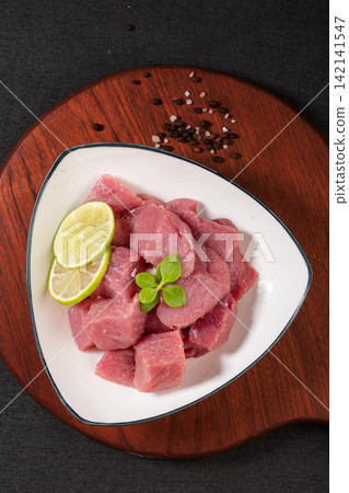 diced Raw Lean Pork Shoulder Meat on Plate diced Raw Lean Pork Shoulder Meat on Plate 142141547